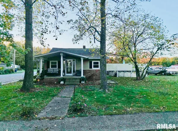 a view of house with a yard