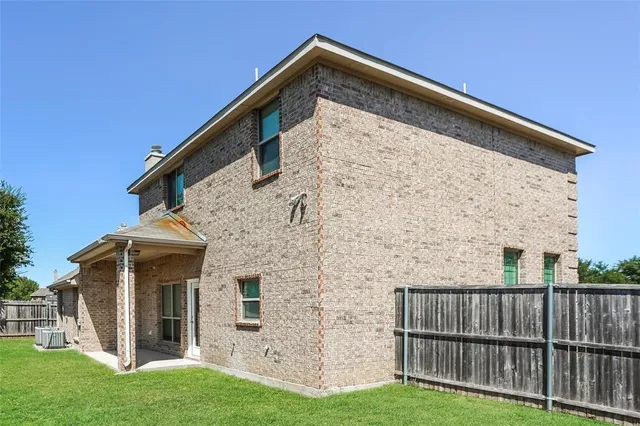 a view of front door of house with yard