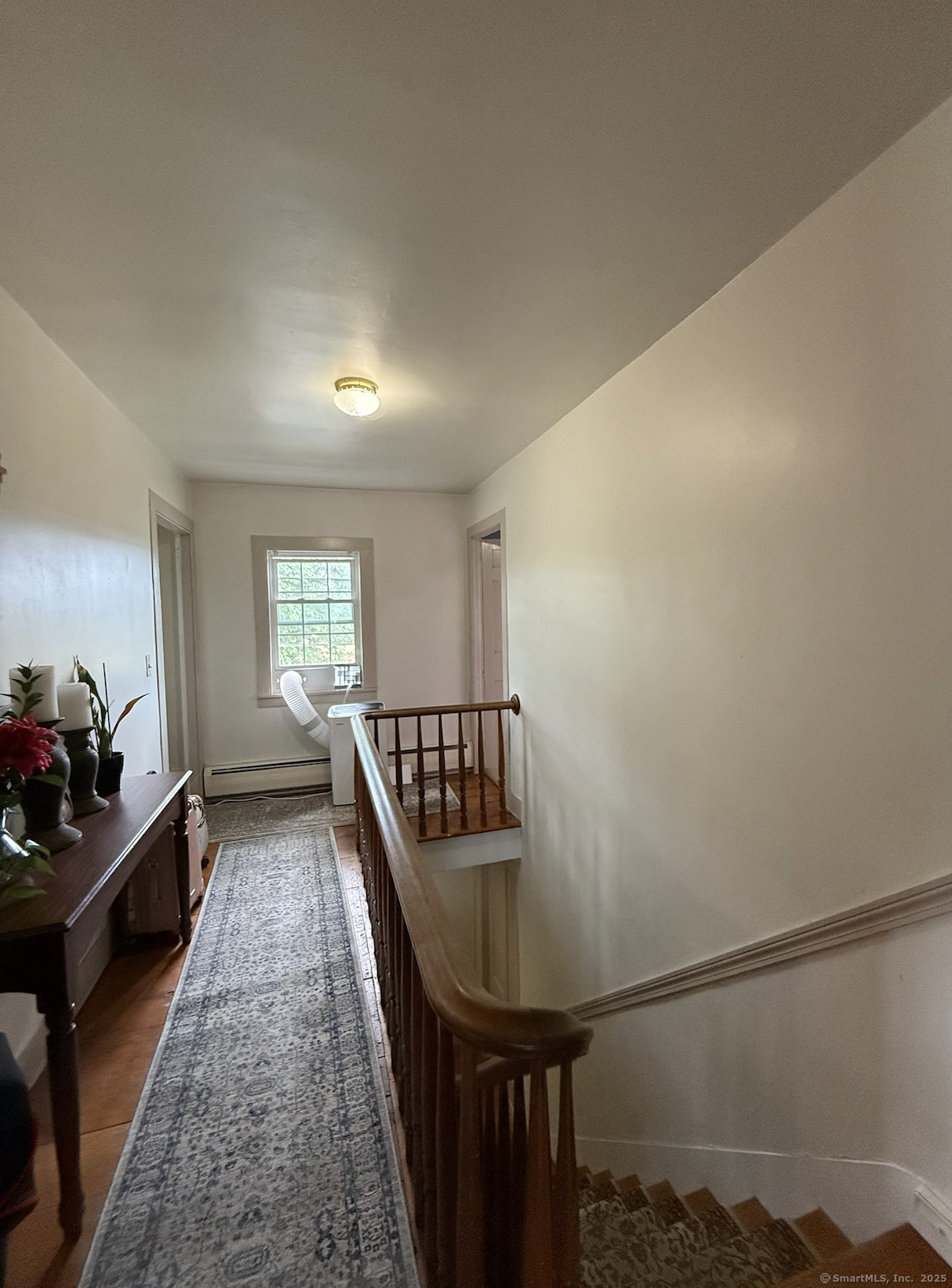 299 Matson Hill Road Glastonbury, CT 06073 - Photo 13 of 16 a living room with furniture and a window