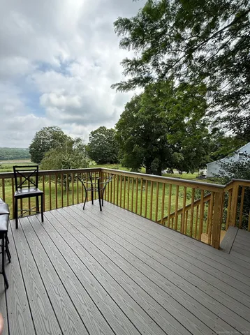 a balcony with trees in front of it