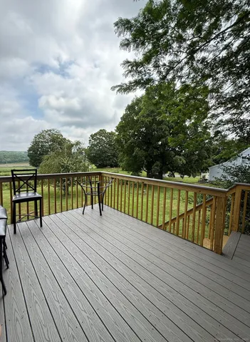 a balcony with trees in front of it