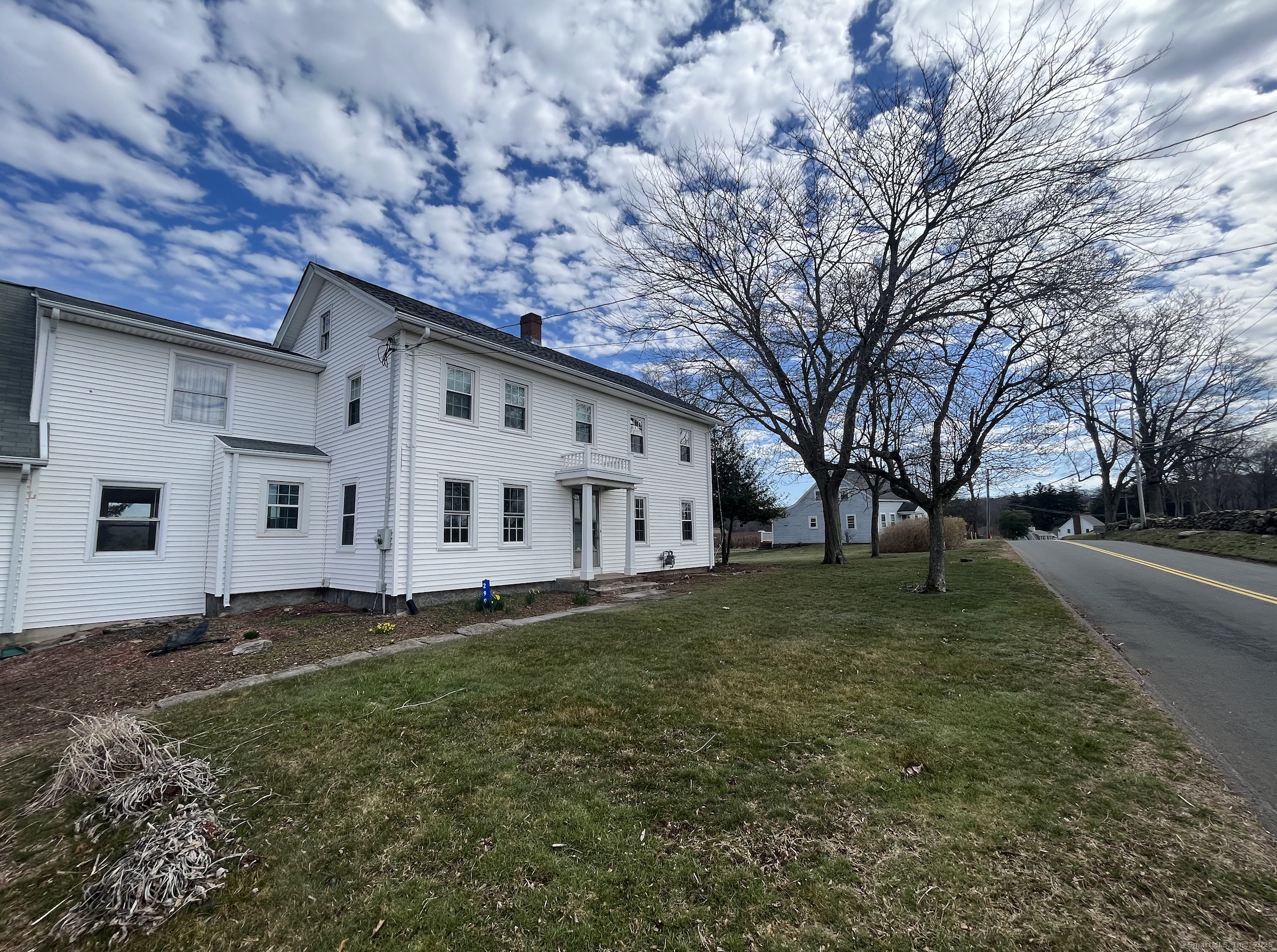 299 Matson Hill Road Glastonbury, CT 06073 - Photo 2 of 16 a big white house with a big yard and large trees