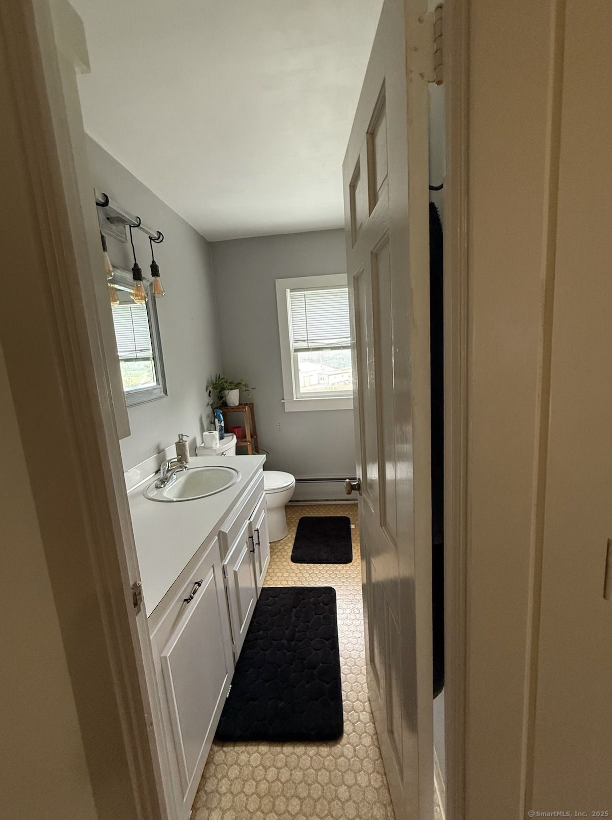 299 Matson Hill Road Glastonbury, CT 06073 - Photo 7 of 16 a bathroom with a tub sink and mirror