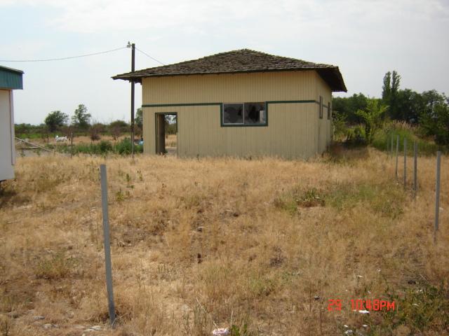 1260 West Wapato Road Wapato, WA 98951 - Photo 22 of 27 a view of a house with a yard