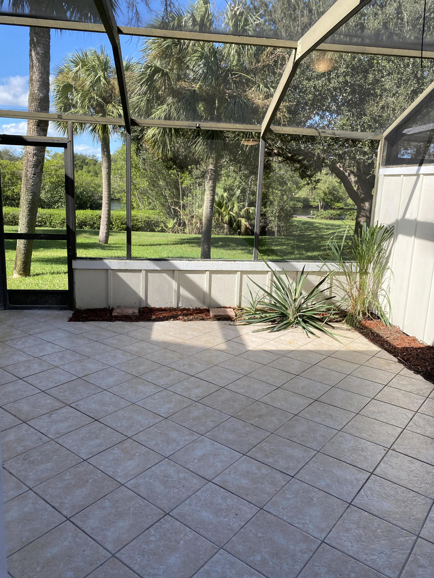 6183 Riverwalk Lane, Unit 3 Jupiter, FL 33458 - Photo 13 of 35 a view of backyard with green space
