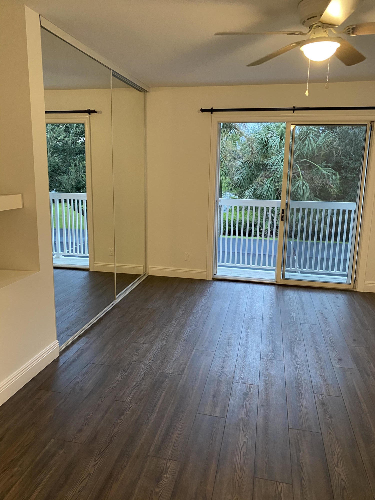 6183 Riverwalk Lane, Unit 3 Jupiter, FL 33458 - Photo 19 of 35 a view of a room with wooden floor and balcony