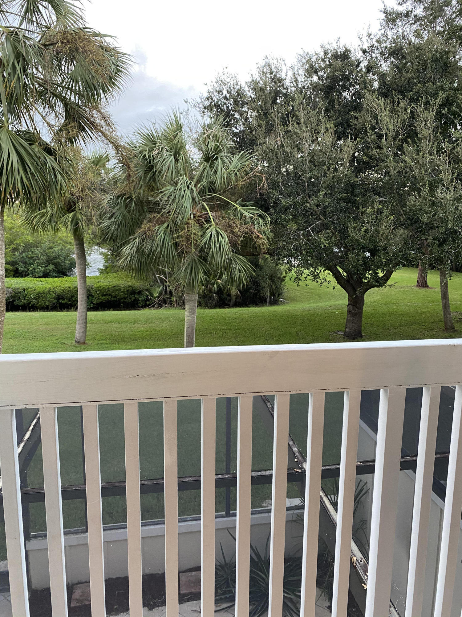 6183 Riverwalk Lane, Unit 3 Jupiter, FL 33458 - Photo 20 of 35 a view of a wooden fence