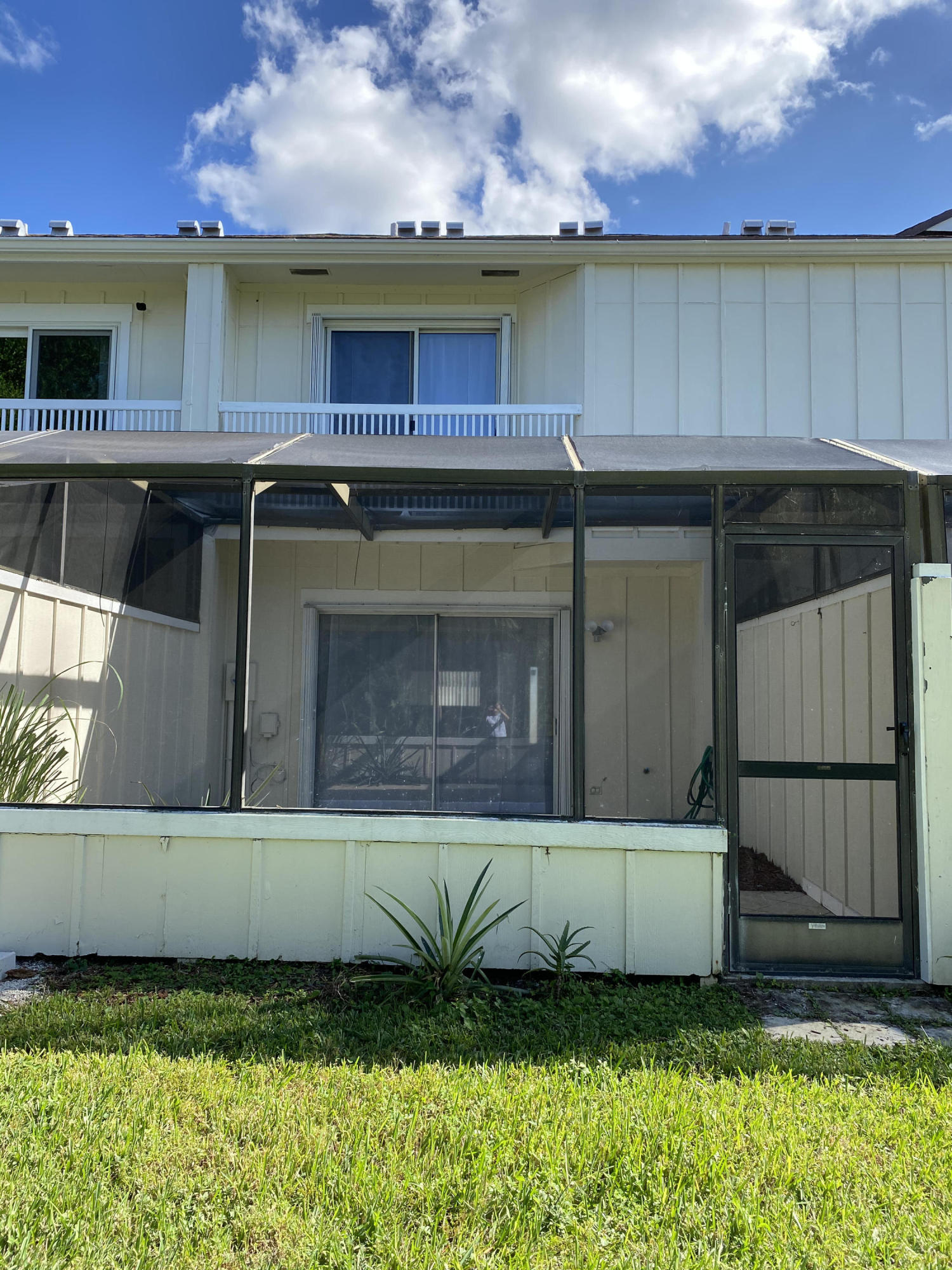 6183 Riverwalk Lane, Unit 3 Jupiter, FL 33458 - Photo 26 of 35 a view of a house with a yard