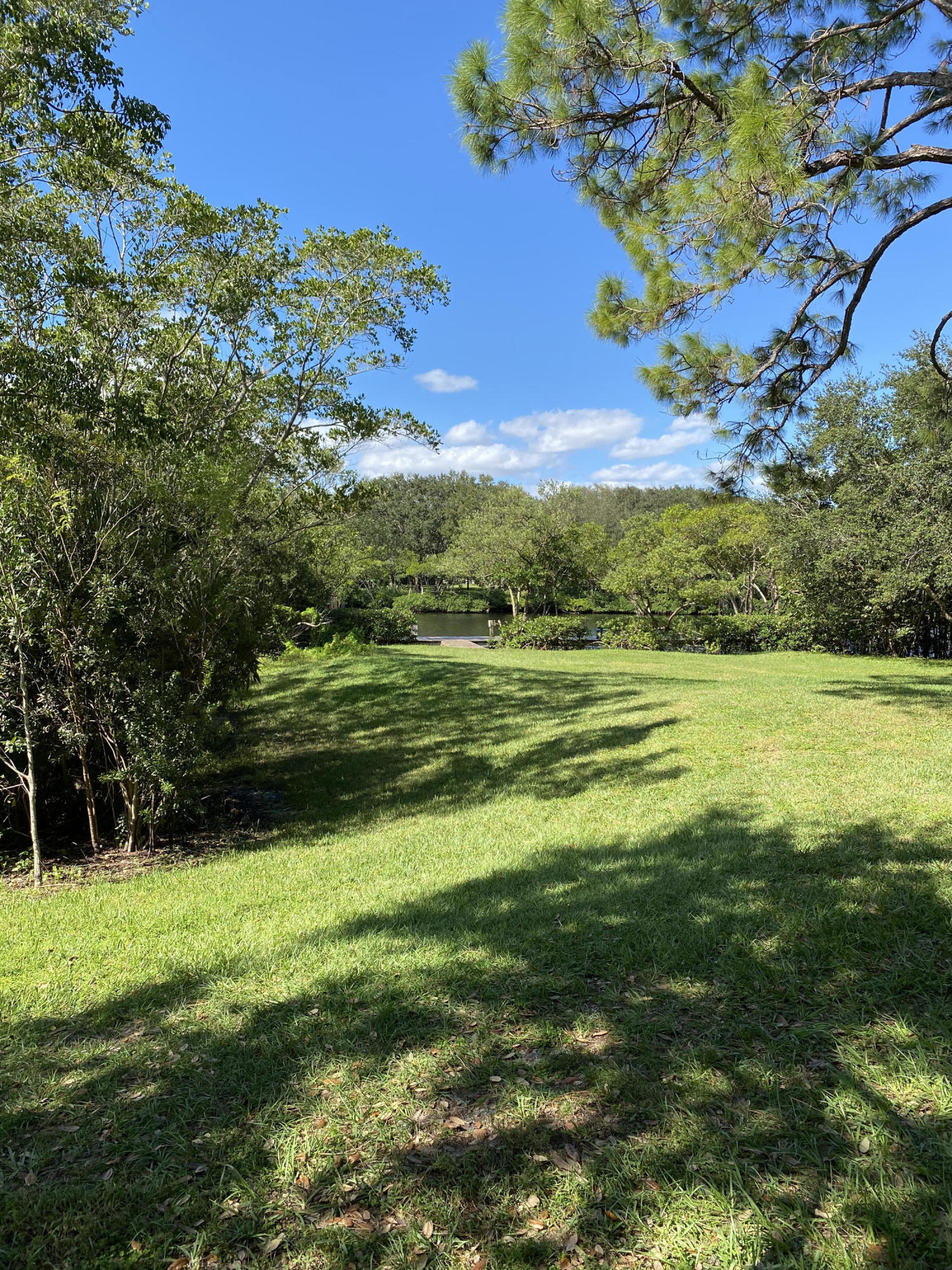 6183 Riverwalk Lane, Unit 3 Jupiter, FL 33458 - Photo 35 of 35 a view of a golf course with a lake