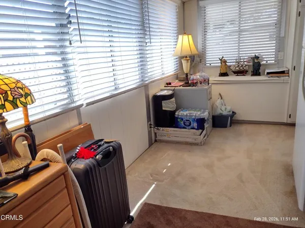 a view of a room with furniture and a window