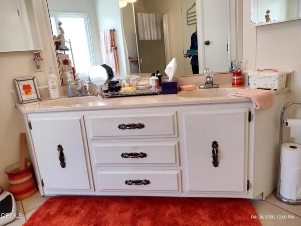 a bathroom with a sink toilet vanity and tub