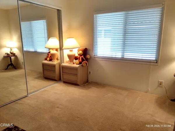 a view of a livingroom with stairs