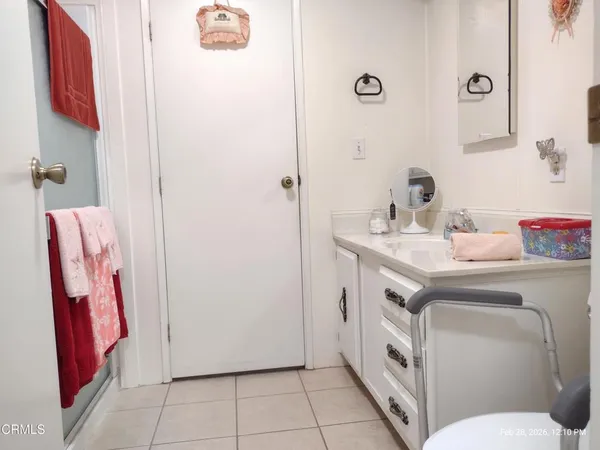 a view of a patio with table and chairs