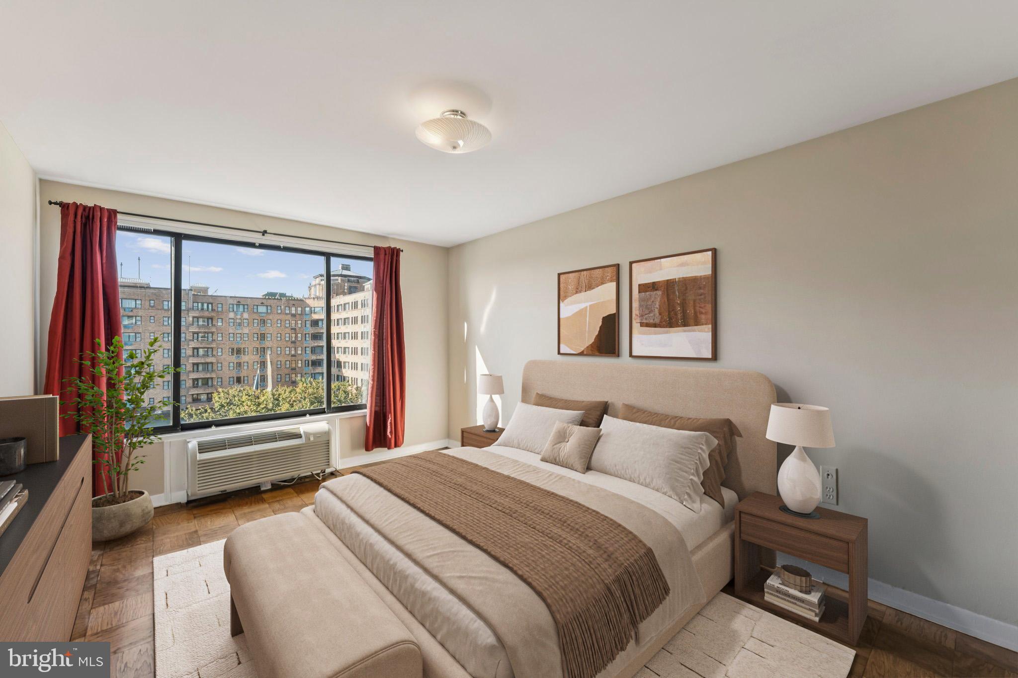 2501 Calvert Street Northwest, Unit 701 Washington, DC 20008 - Photo 14 of 29 a bedroom with a large bed and a large window