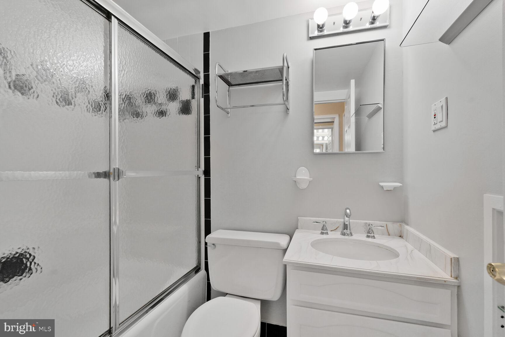 2501 Calvert Street Northwest, Unit 701 Washington, DC 20008 - Photo 17 of 29 a bathroom with a sink toilet and shower