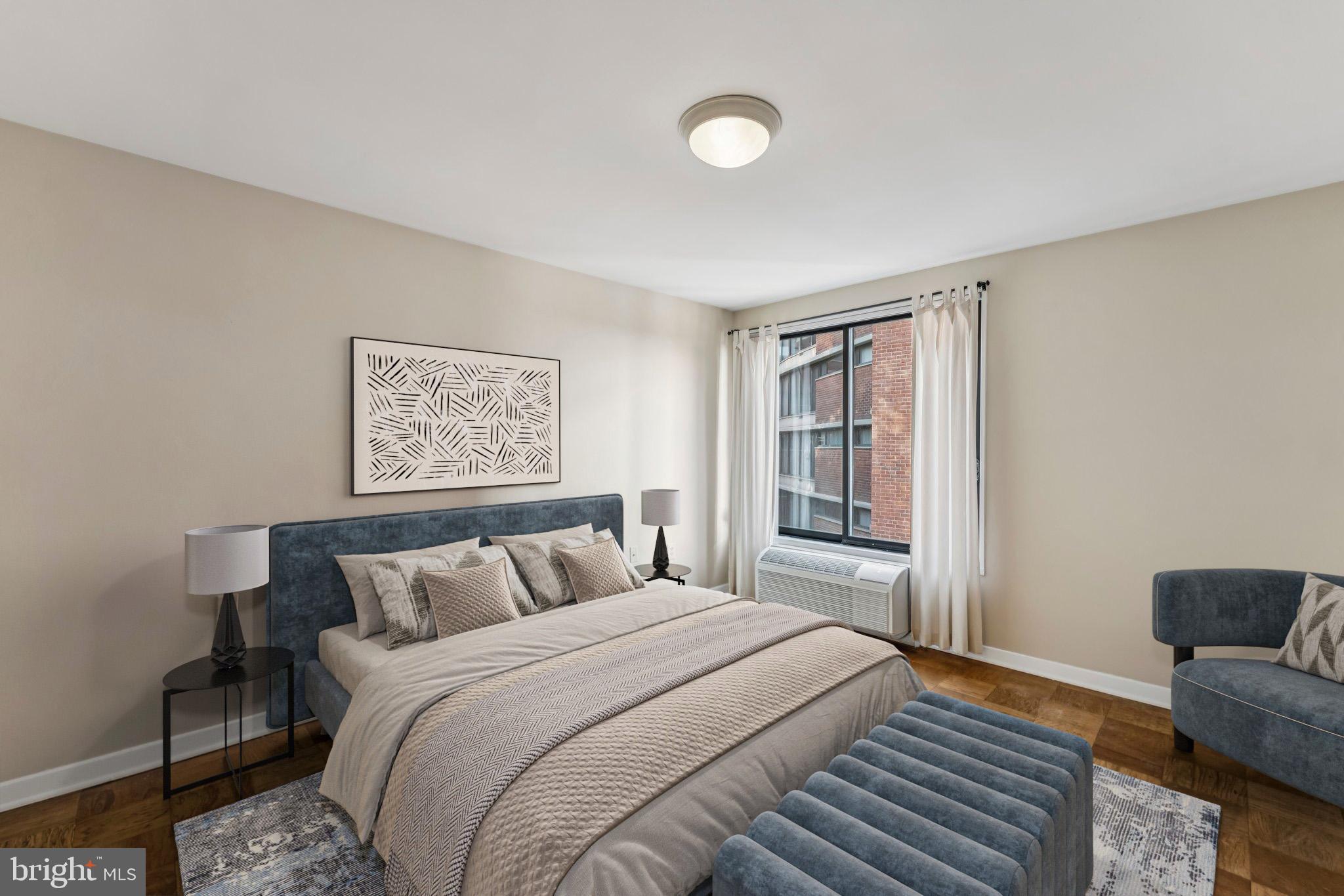 2501 Calvert Street Northwest, Unit 701 Washington, DC 20008 - Photo 20 of 31 a bedroom with a bed and a couch