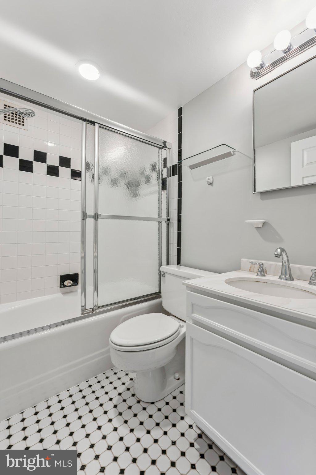 2501 Calvert Street Northwest, Unit 701 Washington, DC 20008 - Photo 22 of 31 a bathroom with a sink toilet and shower