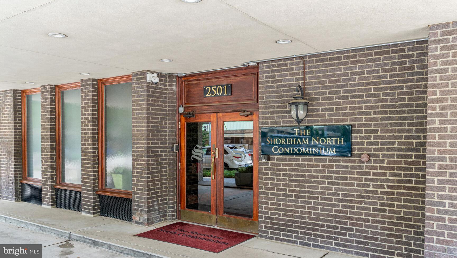2501 Calvert Street Northwest, Unit 701 Washington, DC 20008 - Photo 2 of 29 a front view of a building with glass windows