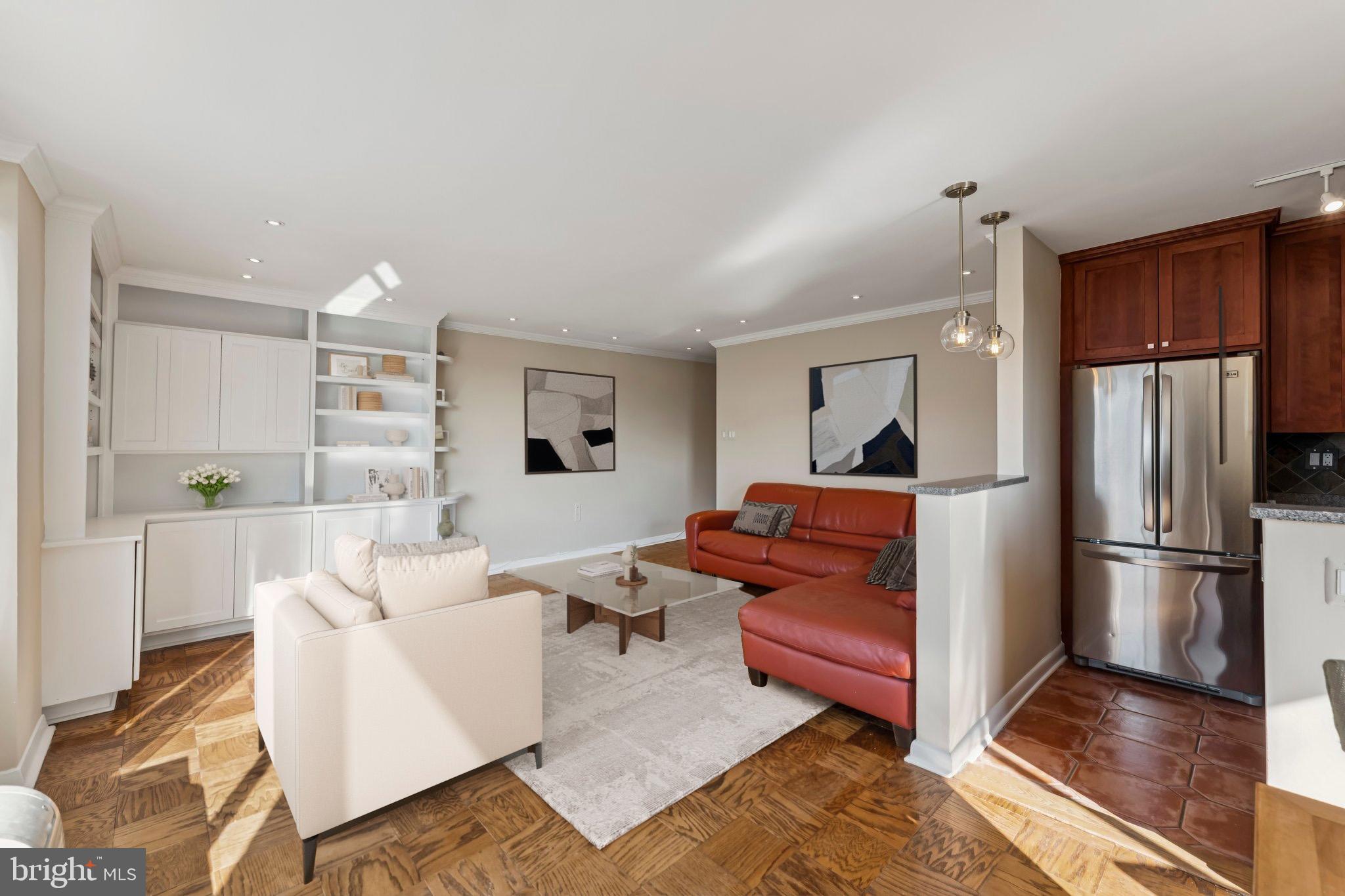 2501 Calvert Street Northwest, Unit 701 Washington, DC 20008 - Photo 8 of 31 a living room with furniture and a refrigerator