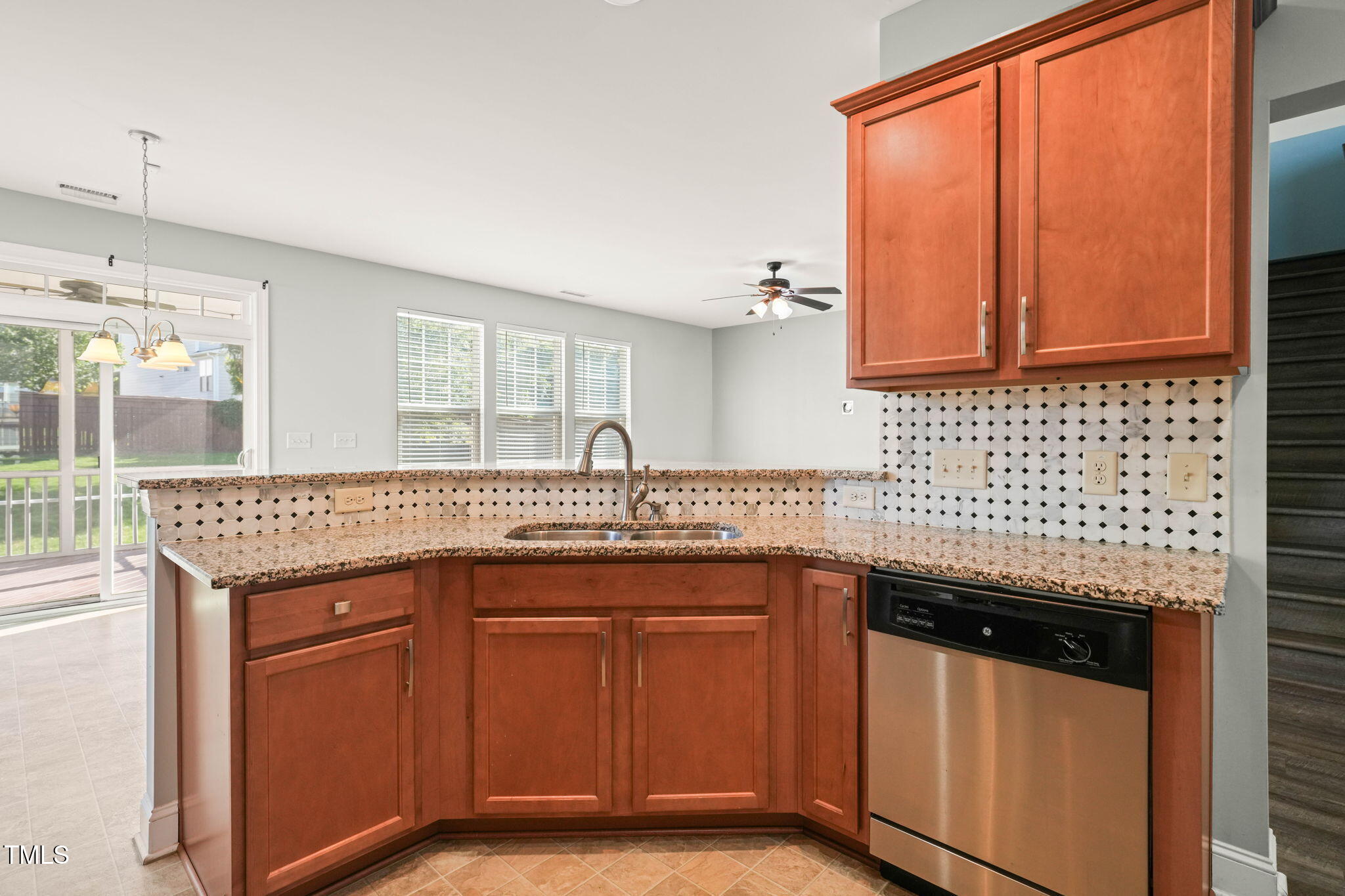 4508 Brintons Cottage Street Raleigh, NC 27616 - Photo 10 of 46 a kitchen with stainless steel appliances granite countertop a sink stove and cabinets