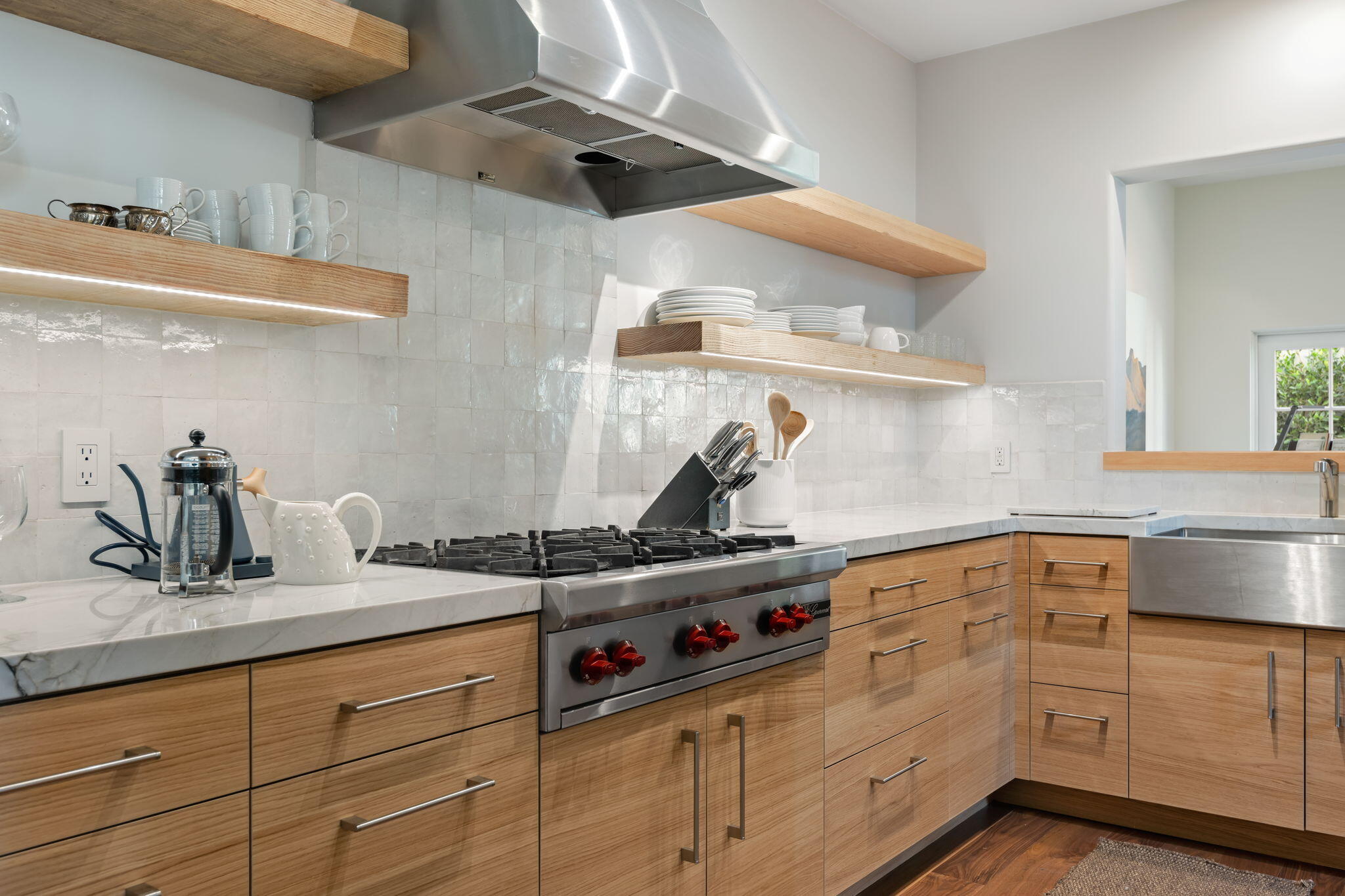 71 Olive Mill Road Montecito, CA 93108 - Photo 12 of 30 a kitchen with white cabinets and appliances