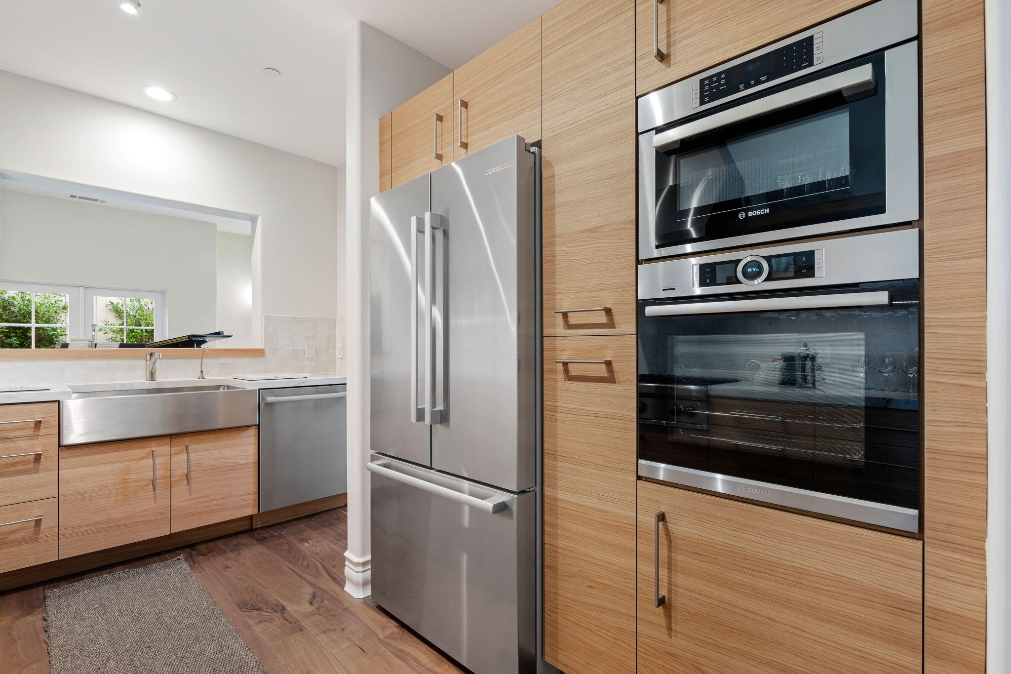 71 Olive Mill Road Montecito, CA 93108 - Photo 13 of 30 a kitchen with granite countertop white cabinets and stainless steel appliances