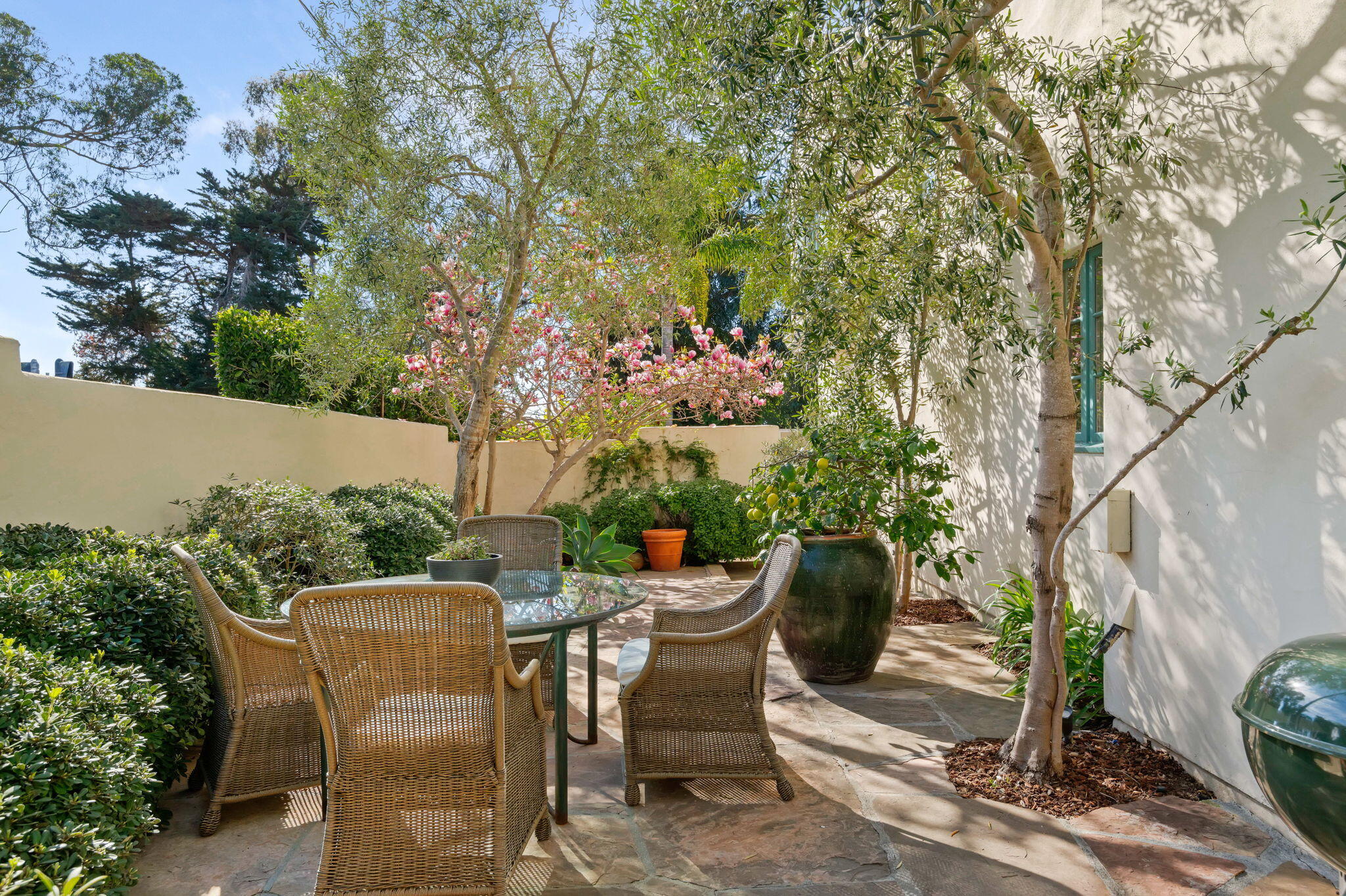 71 Olive Mill Road Montecito, CA 93108 - Photo 19 of 30 a view of a patio with table and chairs and potted plants