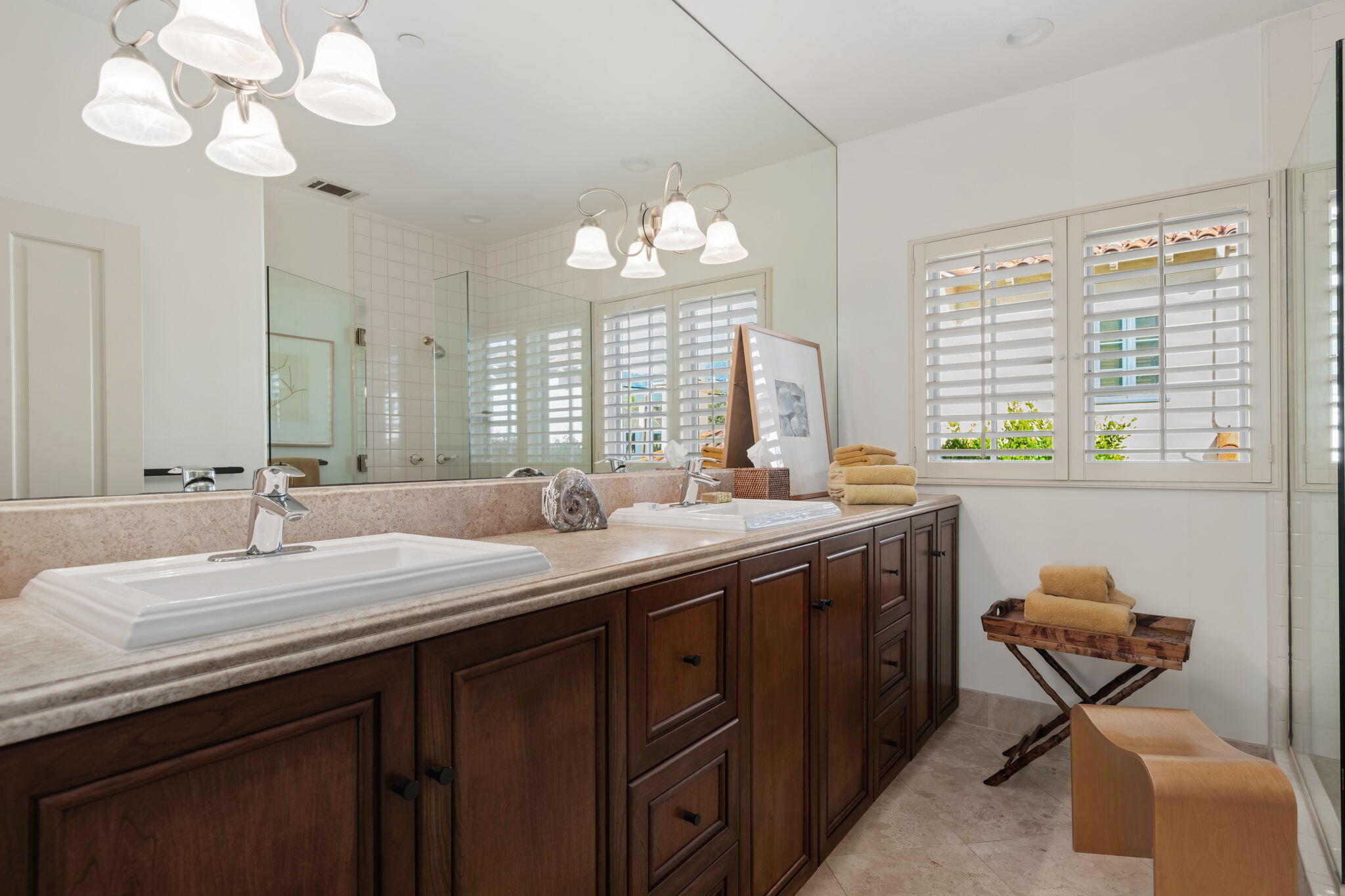 71 Olive Mill Road Montecito, CA 93108 - Photo 22 of 30 a bathroom with a granite countertop sink a large mirror and a toilet