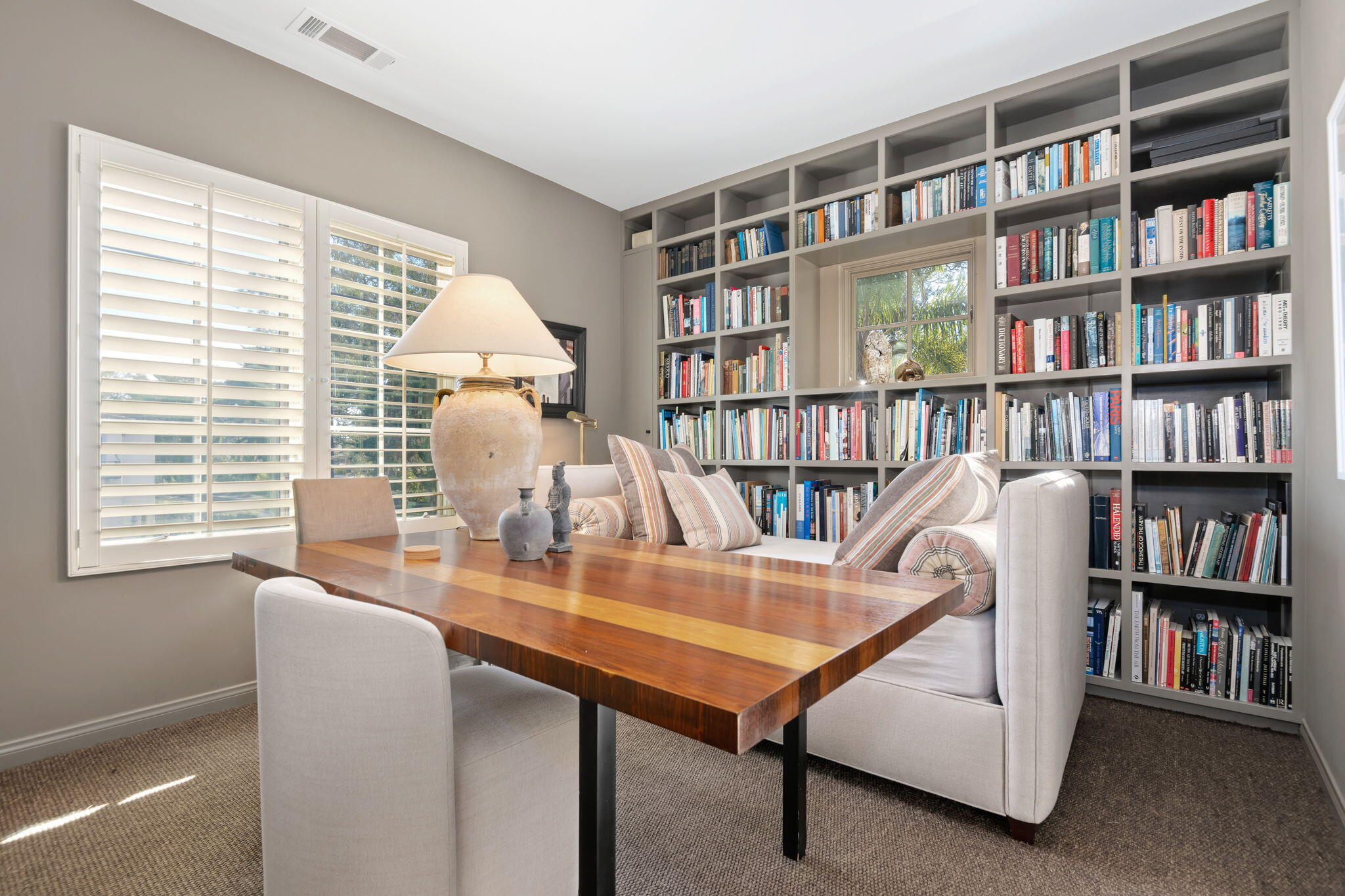 71 Olive Mill Road Montecito, CA 93108 - Photo 30 of 30 a dining room with furniture and a book shelf