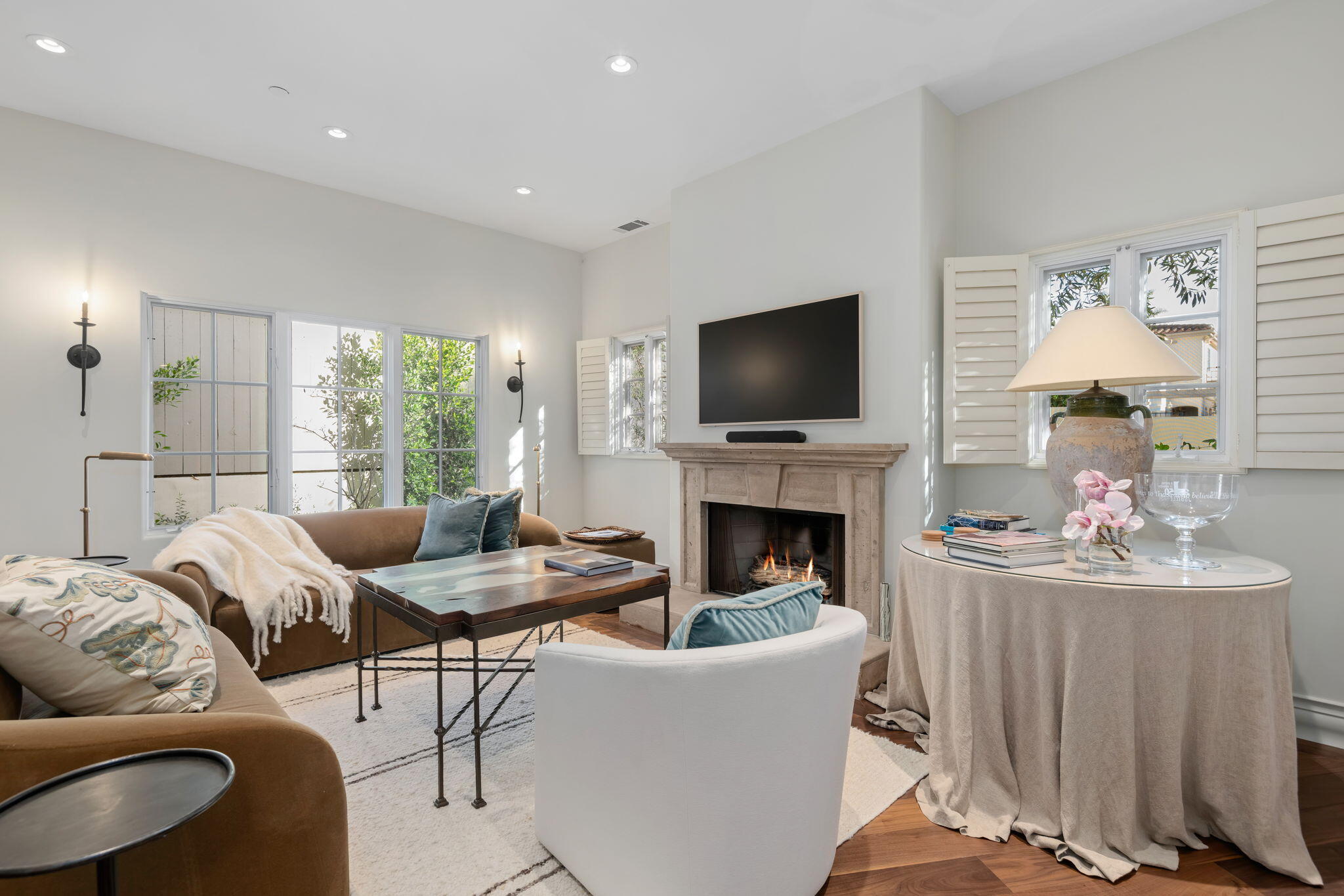 71 Olive Mill Road Montecito, CA 93108 - Photo 5 of 30 a living room with furniture a fireplace and a flat screen tv