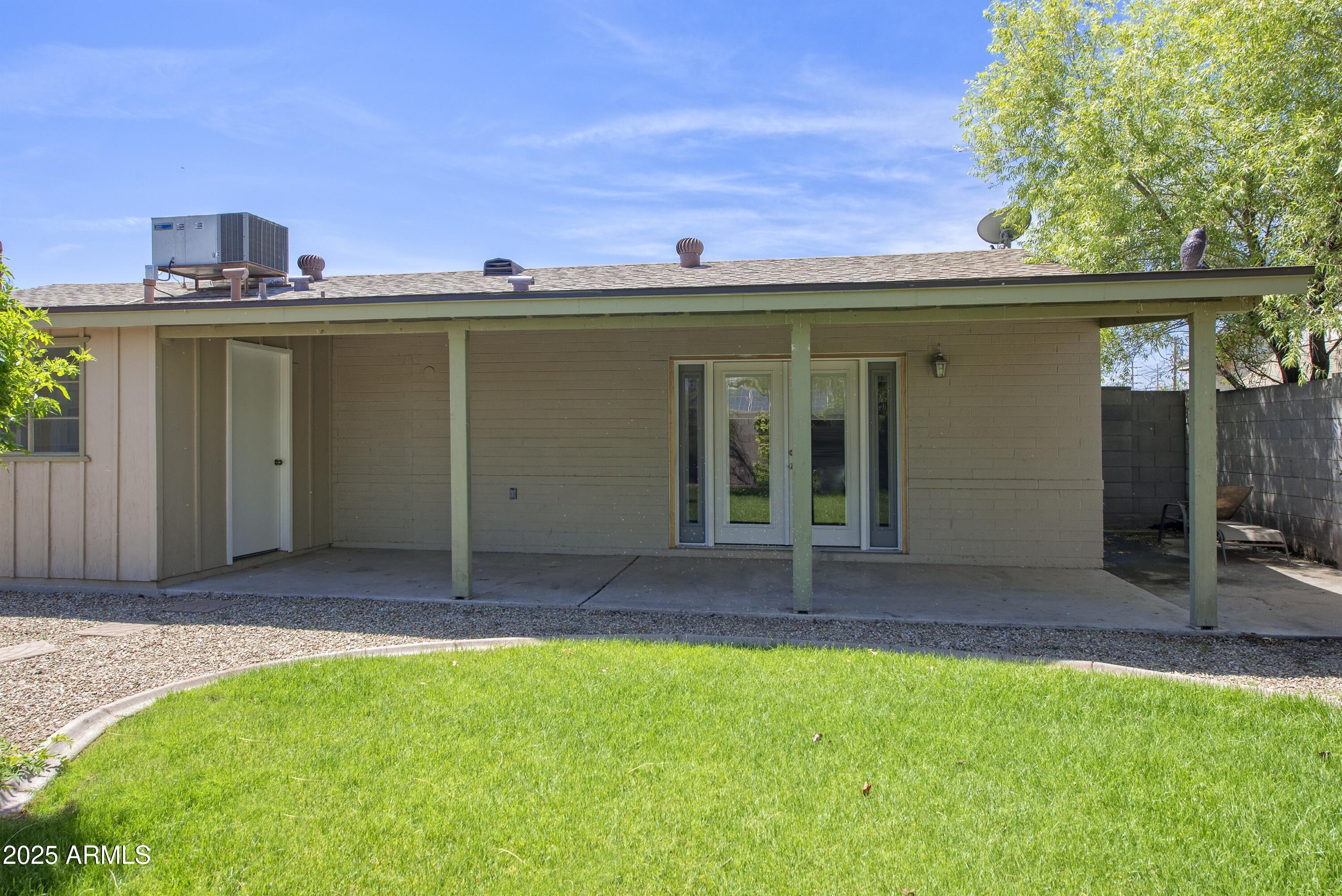 36 East Fillmore Street Tempe, AZ 85288 - Photo 14 of 15 a front view of a house with a yard