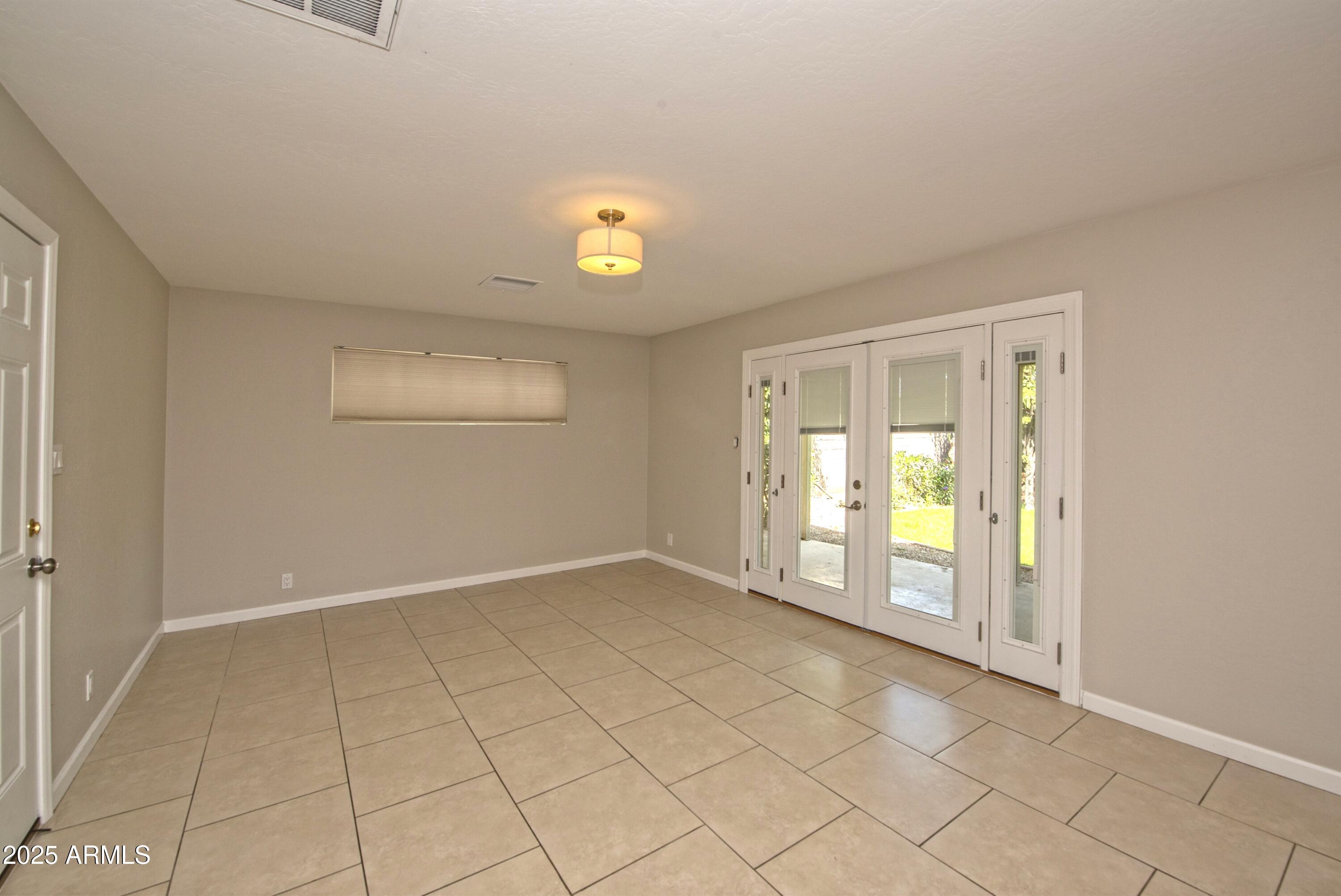 36 East Fillmore Street Tempe, AZ 85288 - Photo 3 of 15 an empty room with windows