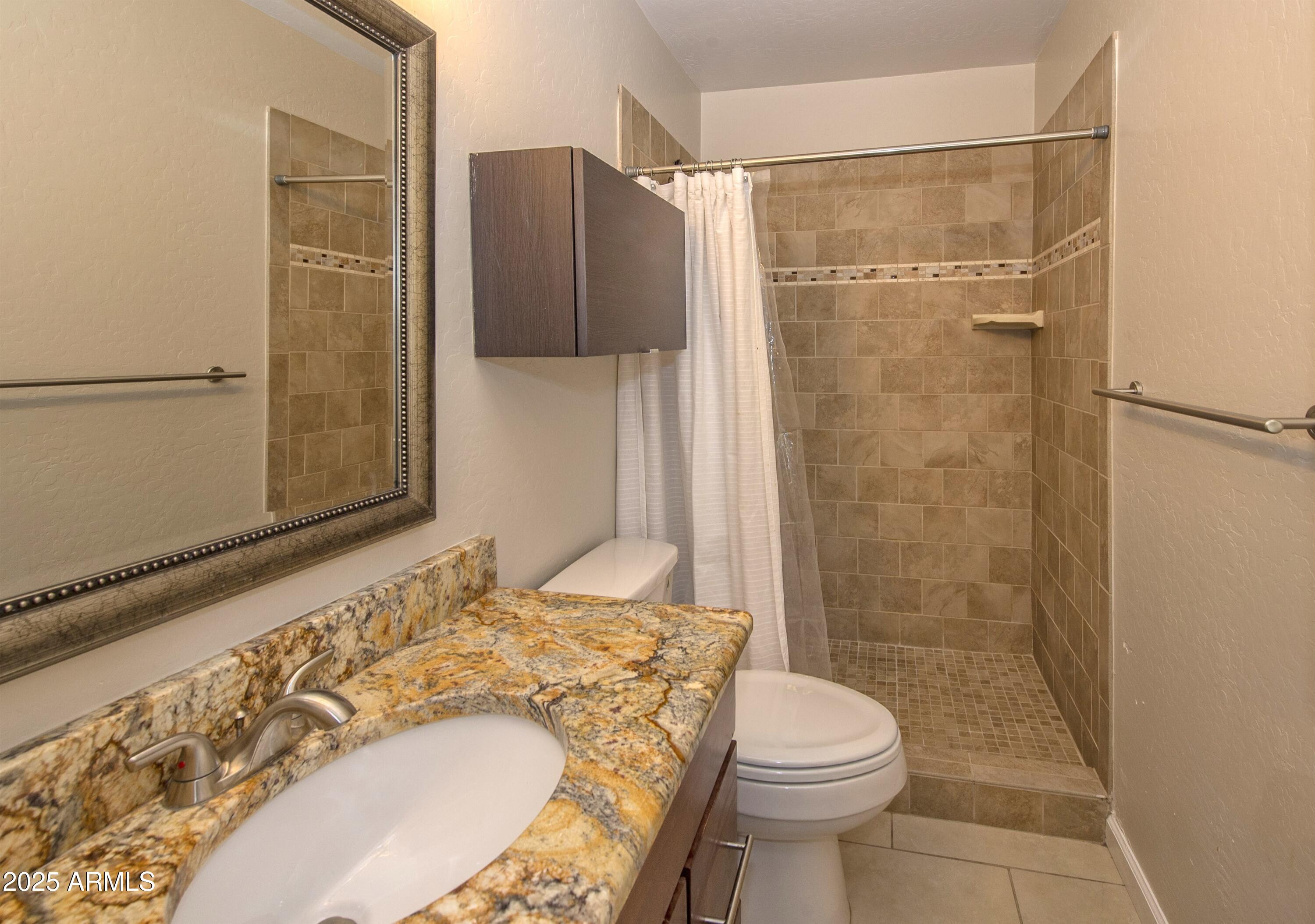 36 East Fillmore Street Tempe, AZ 85288 - Photo 9 of 15 a bathroom with a sink and a toilet