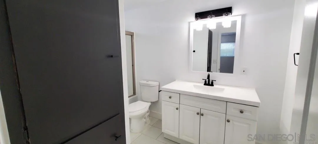 2743-2745 Ridgeway Drive National City, CA 91950 - Photo 14 of 35 a bathroom with a sink and a mirror