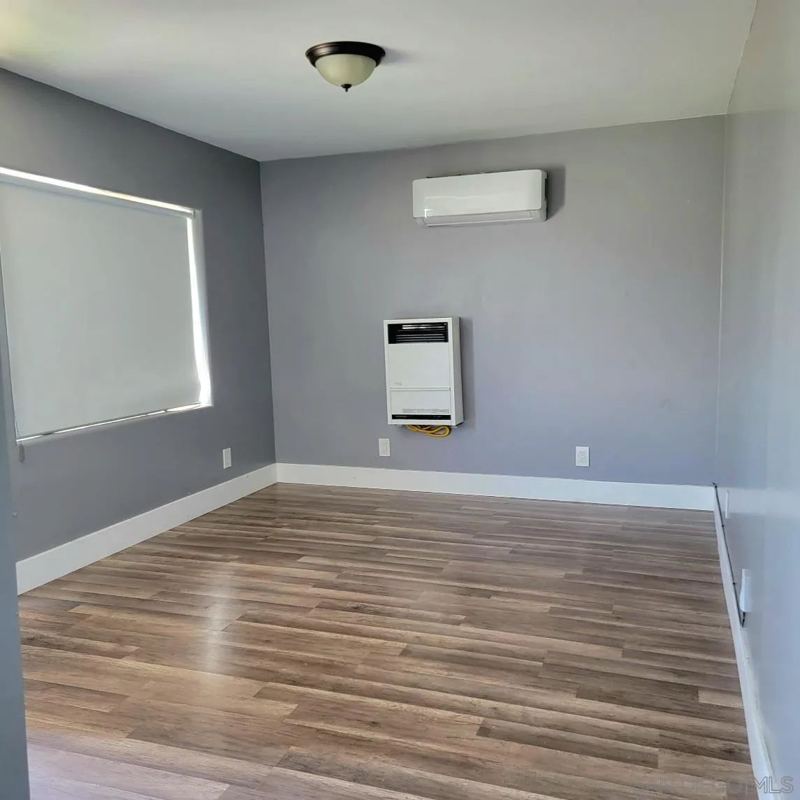 2743-2745 Ridgeway Drive National City, CA 91950 - Photo 27 of 35 a view of a room with wooden floor and a window