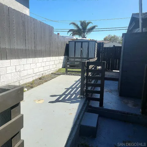 a view of a chairs and table in the patio