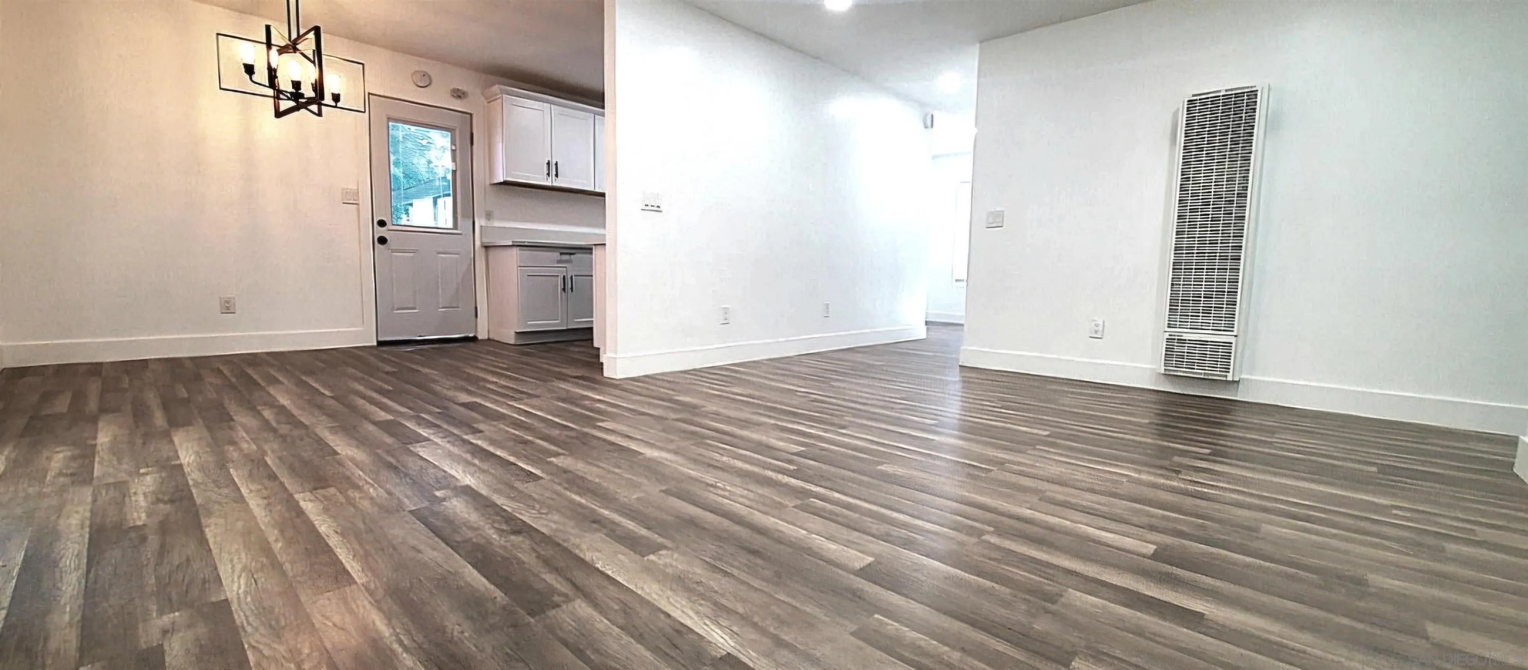 2743-2745 Ridgeway Drive National City, CA 91950 - Photo 6 of 35 a view of a kitchen with wooden floor and a sink