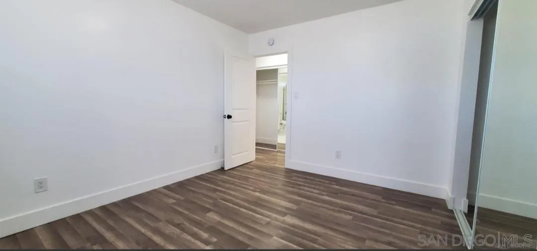 2743-2745 Ridgeway Drive National City, CA 91950 - Photo 10 of 35 a view of an empty room with wooden floor and closet