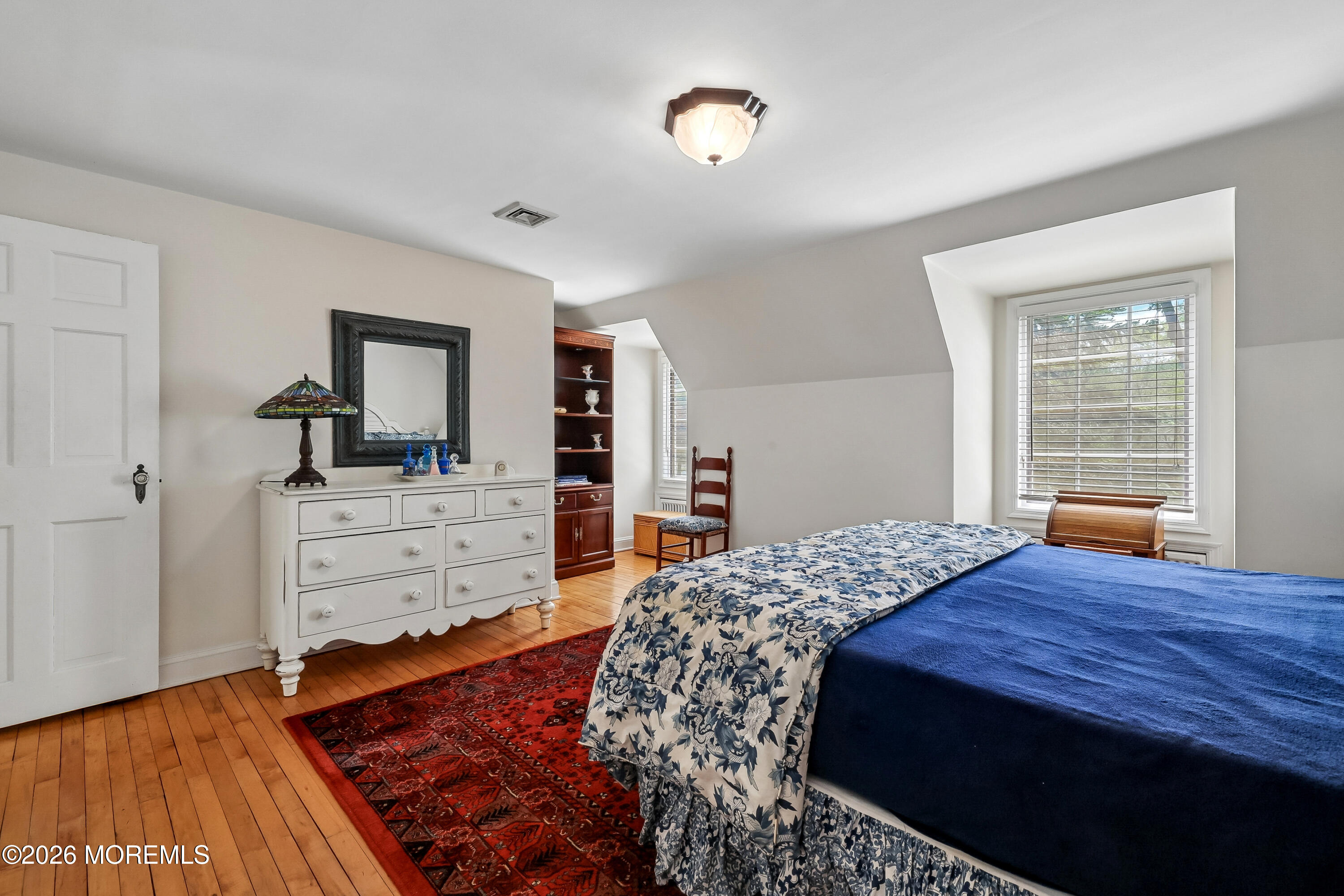 187 Hockhockson Road Colts Neck, NJ 07722 - Photo 42 of 55 a bed room with a bed and a dresser