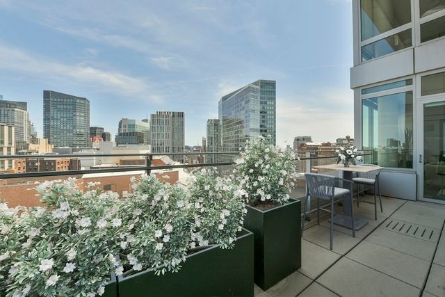 a bathroom with a granite countertop sink mirror and toilet