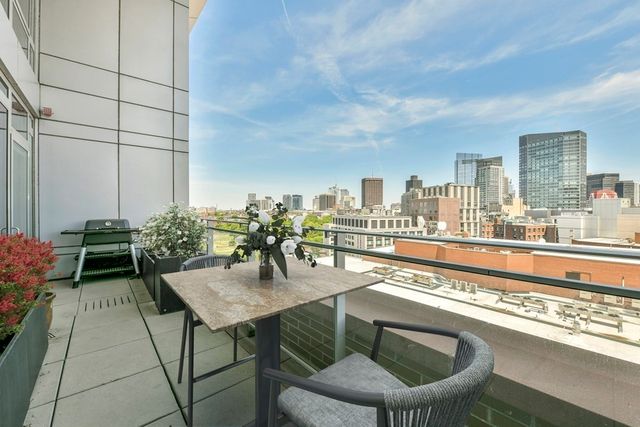 a view of city with tall buildings