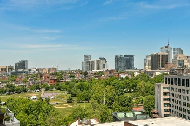 a spacious bedroom with a bed and a large window