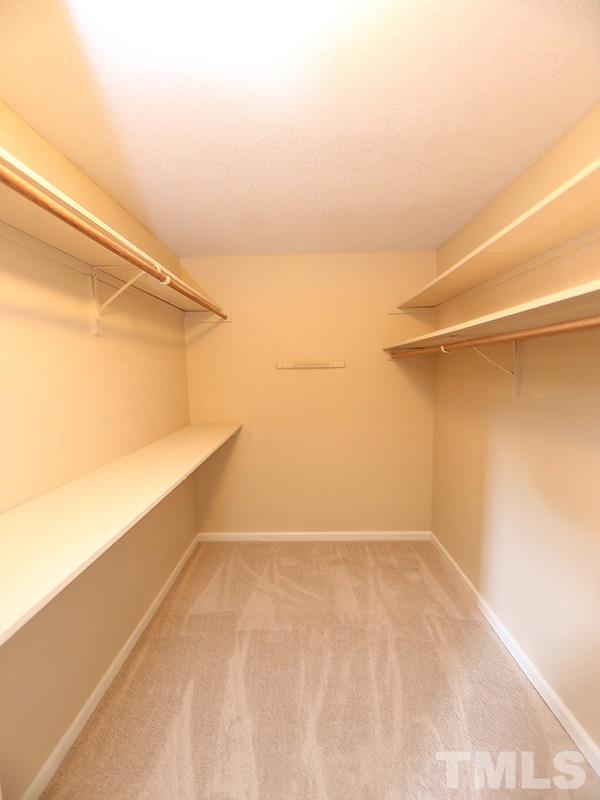 6108 New Market Way Raleigh, NC 27609 - Photo 11 of 17 a view of a room with racks on the wall