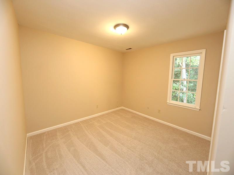 6108 New Market Way Raleigh, NC 27609 - Photo 12 of 17 a view of an empty room with a window