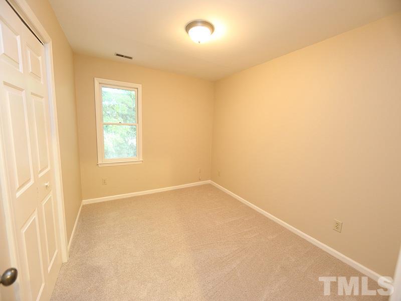 6108 New Market Way Raleigh, NC 27609 - Photo 13 of 17 a view of an empty room with a window