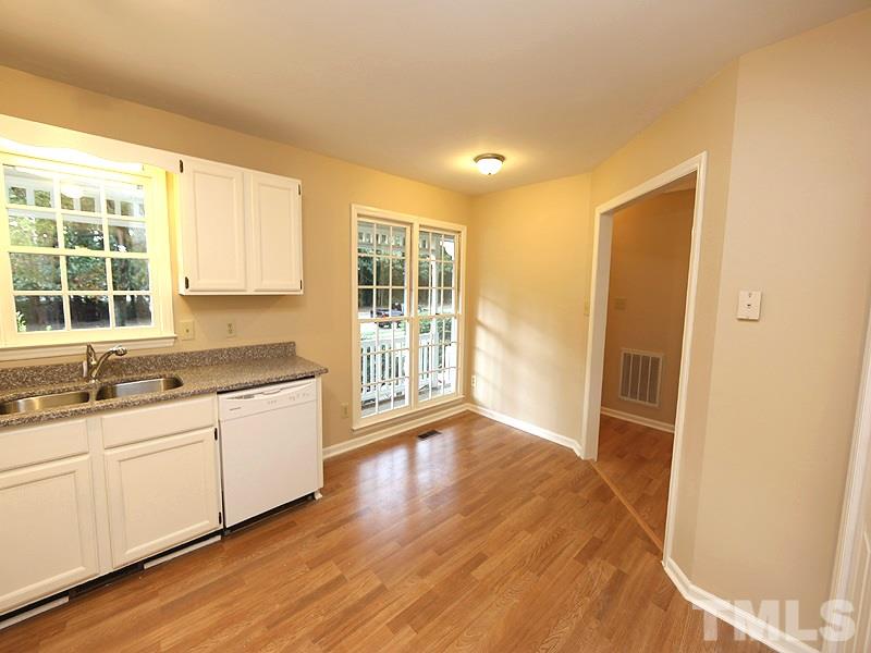 6108 New Market Way Raleigh, NC 27609 - Photo 4 of 17 a kitchen with sink and cabinets