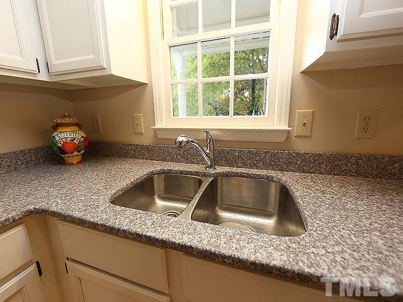 6108 New Market Way Raleigh, NC 27609 - Photo 5 of 17 a kitchen with a sink and a window