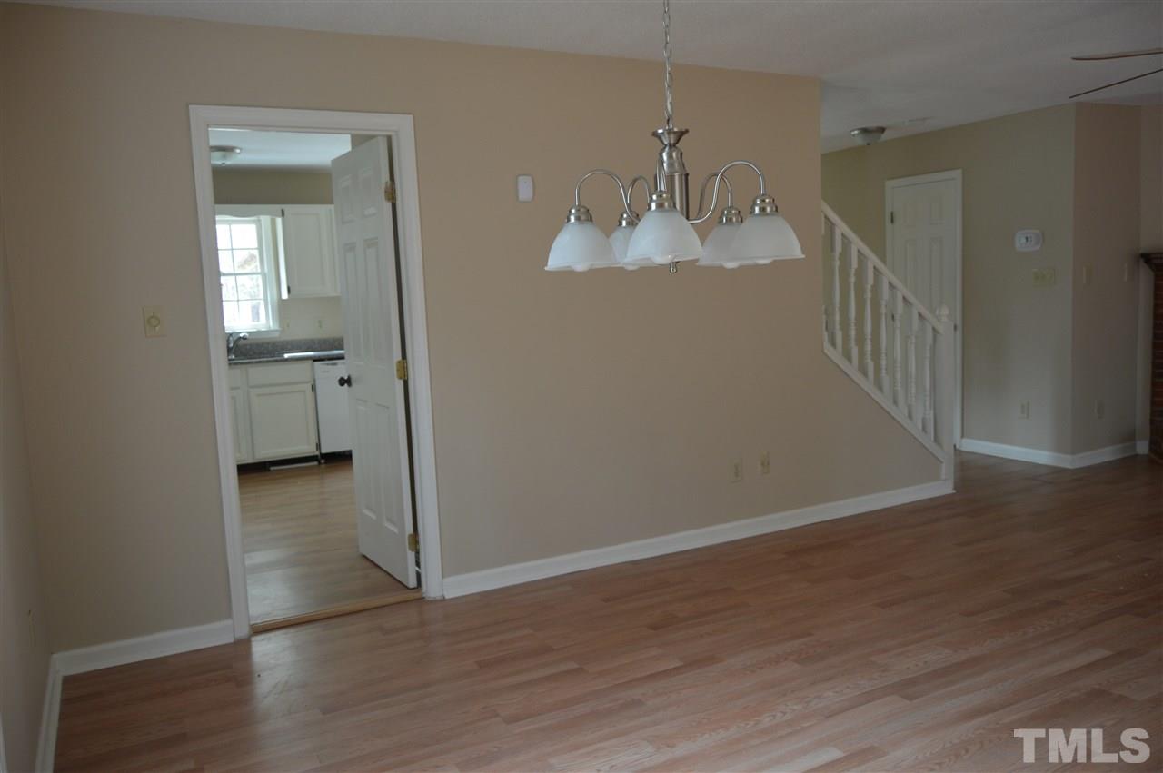 6108 New Market Way Raleigh, NC 27609 - Photo 8 of 17 a view of empty room with wooden floor