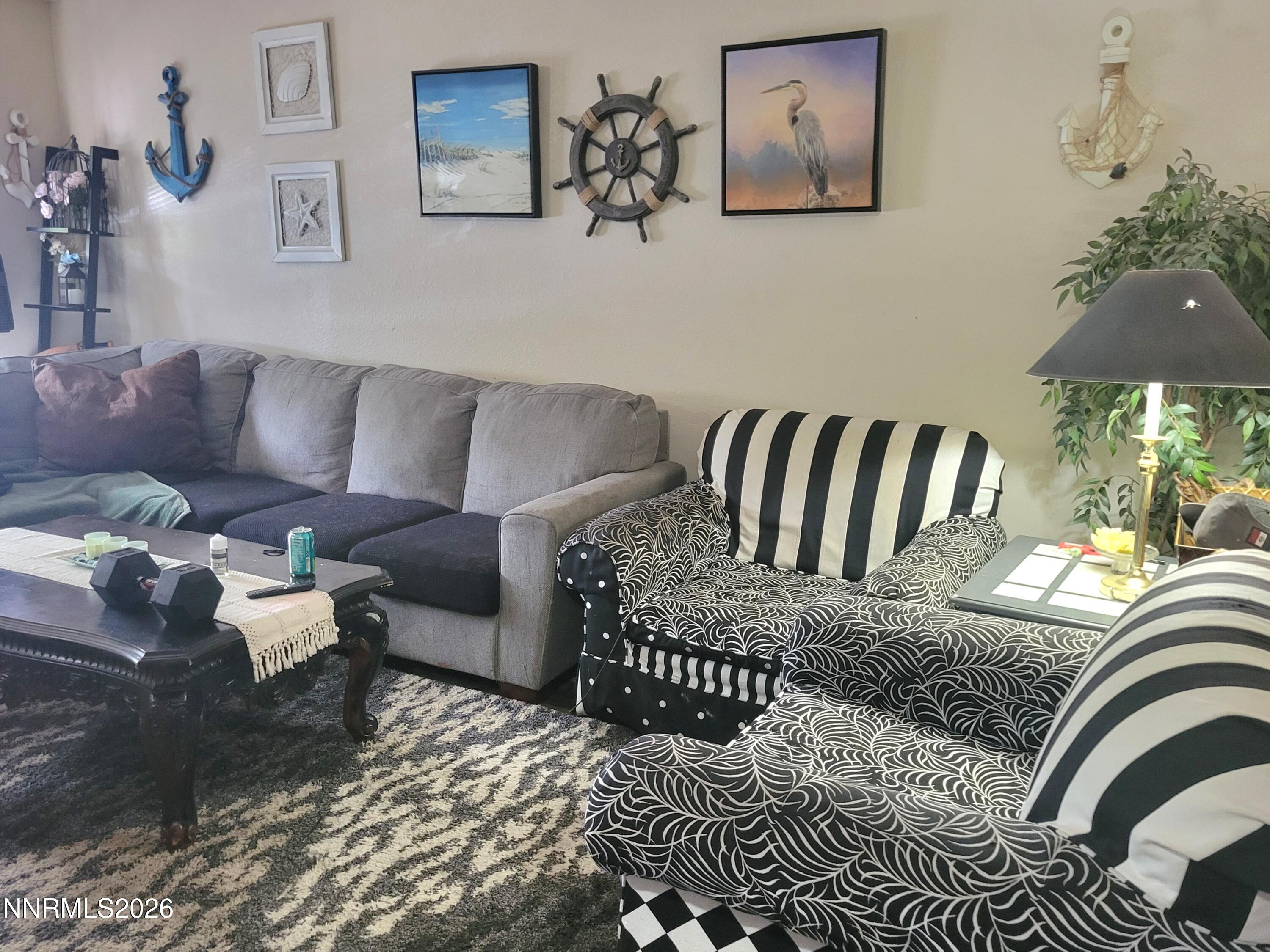 1404 East 9th Street, Unit 3 Reno, NV 89512 - Photo 6 of 29 a living room with furniture and a lamp