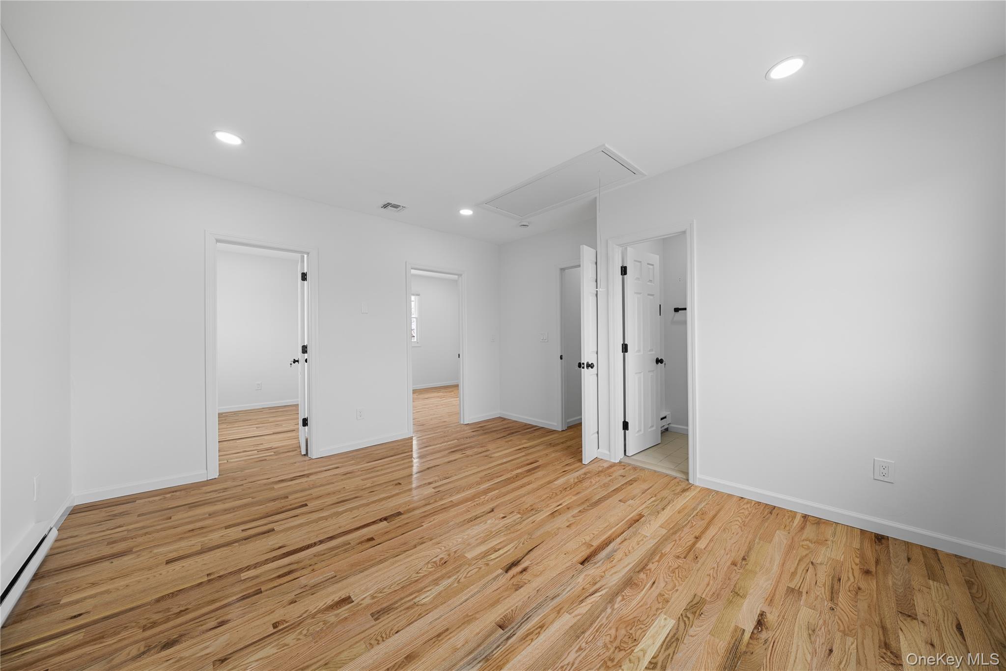 78 Layton Street Freeport, NY 11520 - Photo 13 of 22 a view of empty room with wooden floor